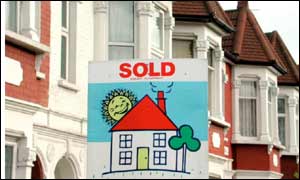 House with Sold sign outside