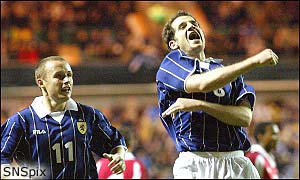 Paul Devlin runs to congratulate Stevie Crawford on his first goal