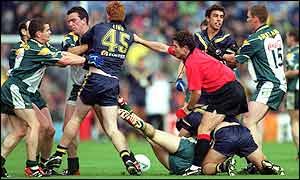 An official tries to restore order during the first Test which Australia won 65-58