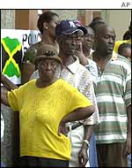 Jamaicans in Kingston line up to vote at a polling station