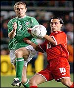 Switzerland Hakin Yakin challenges Ireland's Colin Healy