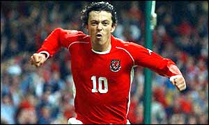 Simon Davies celebrates after giving Wales the lead against Italy