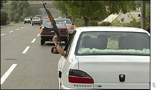 Iraqi's celebrating Saddam Hussein's referendum victory