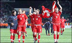 The Swiss team celebrate as they walk off the pitch after their victory over the Republic of Ireland