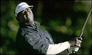 Fiji's Vijay Singh watches the flight of his tee shot at the second hole