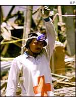 Rescue worker amid the rubble