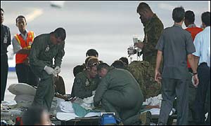 A victim is prepared for their flight to the Royal Perth Hospital, Australia