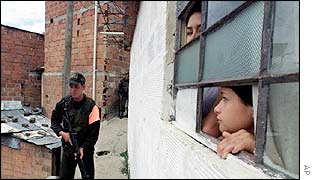 Residents watch a patrol in Medellin