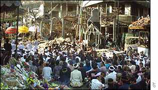 Local Balinese pray at the blast site the victims of Saturday's attack
