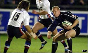 Glasgow's Glenn Metcalfe (right) ponders his next move as he's confronted by Vaughan Going 