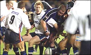 Stu Pinkerton tries to take the ball off Glasgow's Alan Bulloch