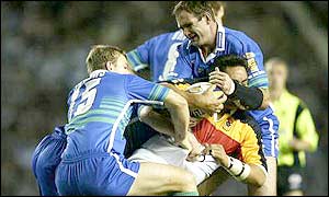 Saints' Tim Jonkers and Chris Joynt tackle Bradford's Joe Vagana 