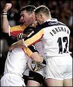 Bradford players smother try-scorer Robbie Paul