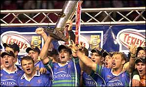 Chris Joynt holds the Super League Grand Final trophy with his St Helens team