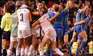 Bradford players restrain skipper James Lowes as he tries to appproach the referee 