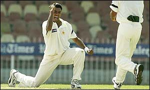 Pakistan leg-spinner Danish Kaneria celebrates the wicket of Shane Warne