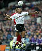 Derby's Lewis Hunt jumps with Forest's Eugen Bopp