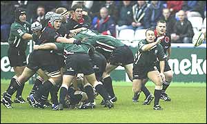 London Irish scrum-half Darren Edwards passes across the back-line