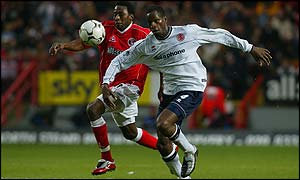 Charlton's Jason Euell and Middlesbrough's Ugo Ehiogu chase the ball