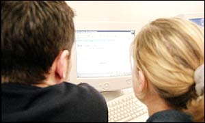 Man and woman looking at internet