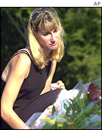 A woman lays a wreath in Australia 