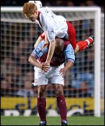 Michael Svensson clambers over Dion Dublin