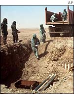 UN weapons inspectors destroying sarin gas rockets in Iraq