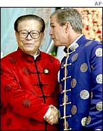 George Bush shakes hand with Jiang Zemin at an APEC summit in Shanghai , October 2001
