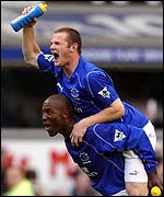 Wayne Rooney leaps on Kevin Campbell