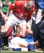 Roy Keane stands over Alf Inge Haaland