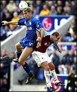 Leicester City's James Scowcroft wins a header against Burnley's Dean West 