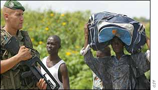 French soldier watching Daloa residents flee