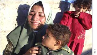 Aisha, the wife of terror suspect Mahmud Issa, breaks down as her home is demolished