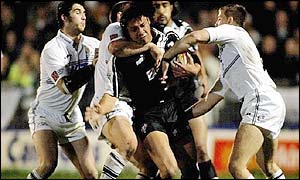 New Zealand's Clinton Toopi is tackled by Hull's defence