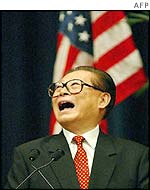 Jiang Zemin laughs at a question