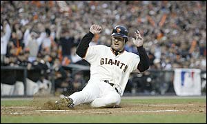 Jeff Kent slides in to score the Giants second run in the first innings