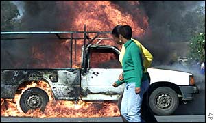 A truck set on fire as part of a fight between taxi companies in South Africa