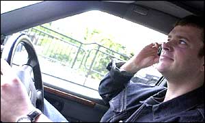 Man driving and talking on mobile phone