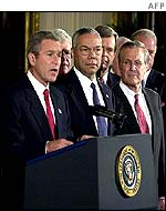US President George W Bush (left) with US Secretary of State Colin Powell (centre) and US Defence Secretary Donald Rumsfeld