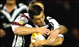 Darren Albert tackels Robbie Paul of New Zealand