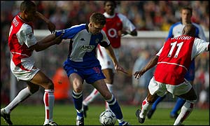 Arsenal's Gilberto and Sylvain Wiltord surround Nils-Eric Johansson of Blackburn