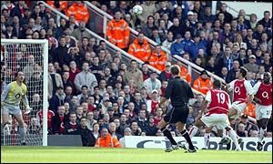 Arsenal keeper David Seaman watches helplessly as Edu (second right) loops the ball into his own goal