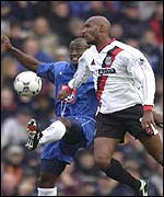 Stern John and Nicolas Anelka challenge for the ball