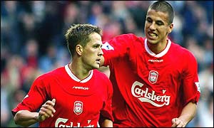 Owen is congratulated by Baros after his winning penalty