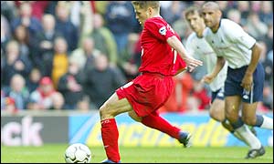 Liverpool have a four point lead at the top of the Premiership after Michael Owen's late penalty give s them a 2-1 win 