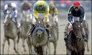 Mike Smith's mount Composure is just edged by Storm Flag, ridden by Johnny Velazquez