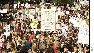 Protesters in Constitution Gardens, Washington DC holding banners