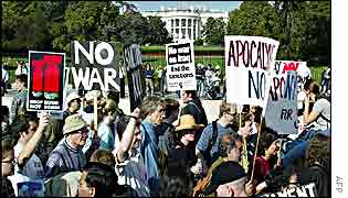 Anti-war protesters march in front of the White House, 26 October, 2002