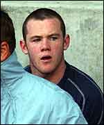 Wayne Rooney watches from the bench