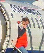 Passenger getting off the plane